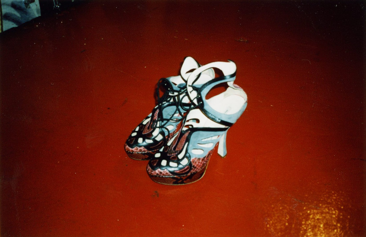 Miu Miu high heels on a red floor
