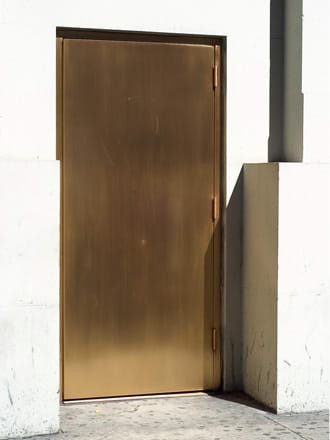 A golden door without door handles